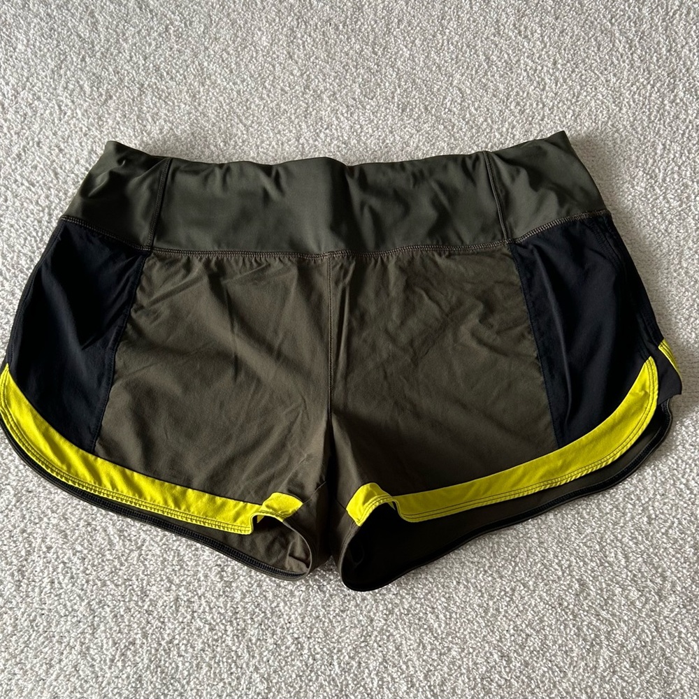 Athleta Olive Green running free short 3,5”with Yellow Trim